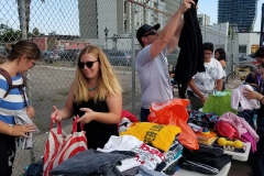 Preparing some of the clothes for the homeless in downtown San Diego.