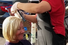 Tammy cuts a homeless woman's hair in downtown San Diego.
