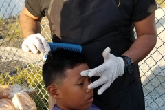 Santos gets his hair cut by one of the stylist from the Country Club Barber Shop