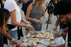 Anne and Grace putting sandwiches into bags to feed the homeless on 9/11