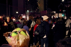 The women volunteers of the Streets of Hope San Diego pass out clothes to homeless women.