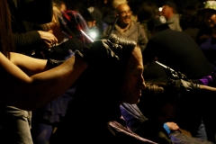 Close up of A homeless man gets his hair cut on Thanksgiving
