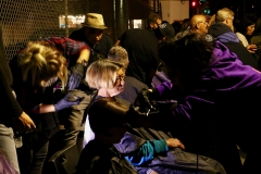 A homeless women gets her hair cut on Thanksgiving in downtown San Diego