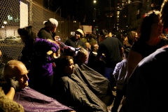 The homeless get their hair cut on the streets of San Diego downtown