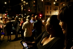 Emma smiles as she's shown a photo of downtown homeless children at our Thanksgiving event