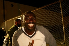 Streets of Hope San Diego volunteer Conrad smiles as he sees all the smile of the homeless at our Thanksgiving event.