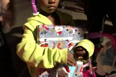 Little homeless girl Christiana gets another Christmas present after getting a bike and a helmet.