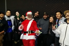 Santa and the homeless hair cutting crew at our Christmas homeless event.