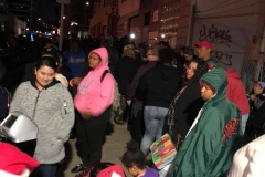 The homeless kids downtown open their Christmas gifts.