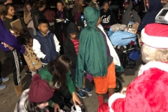 Homeless kids line up to get their Christmas gift at our homeless Christmas event.