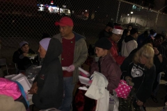 The homeless are helped by Streets of Hope volunteers on Christmas in our clothing donations area.