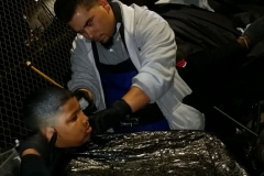 Cutting a homeless boy's hair on Christmas.