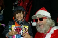 Look at that smile on a little homeless girl after Streets of Hope Santa and Dan gave her Barbie and Ken doll gifts.