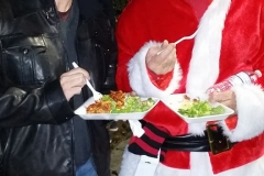 Tammy and Santa both eat a hot meal along with the homeless on Christmas.