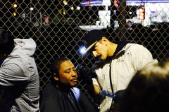 Mario takes great care in cutting a homeless man's hair on Christmas