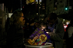 A homeless man searches through our clothing donations at our Christmas event.