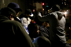 Cutting the homeless hair in the dark. Now that's a commitment to helping San Diego's homeless on Christmas.