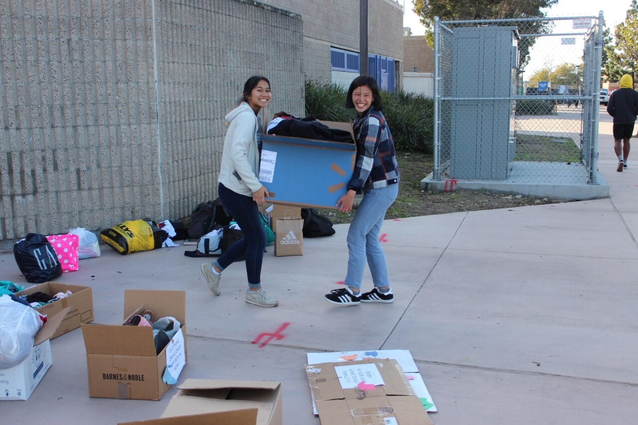 All smiles as the Acts of Kindness Team at Mira Mesa High School collect clothing donations for San Diego's homeless