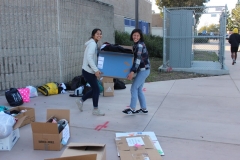 All smiles as the Acts of Kindness Team at Mira Mesa High School collect clothing donations for San Diego's homeless
