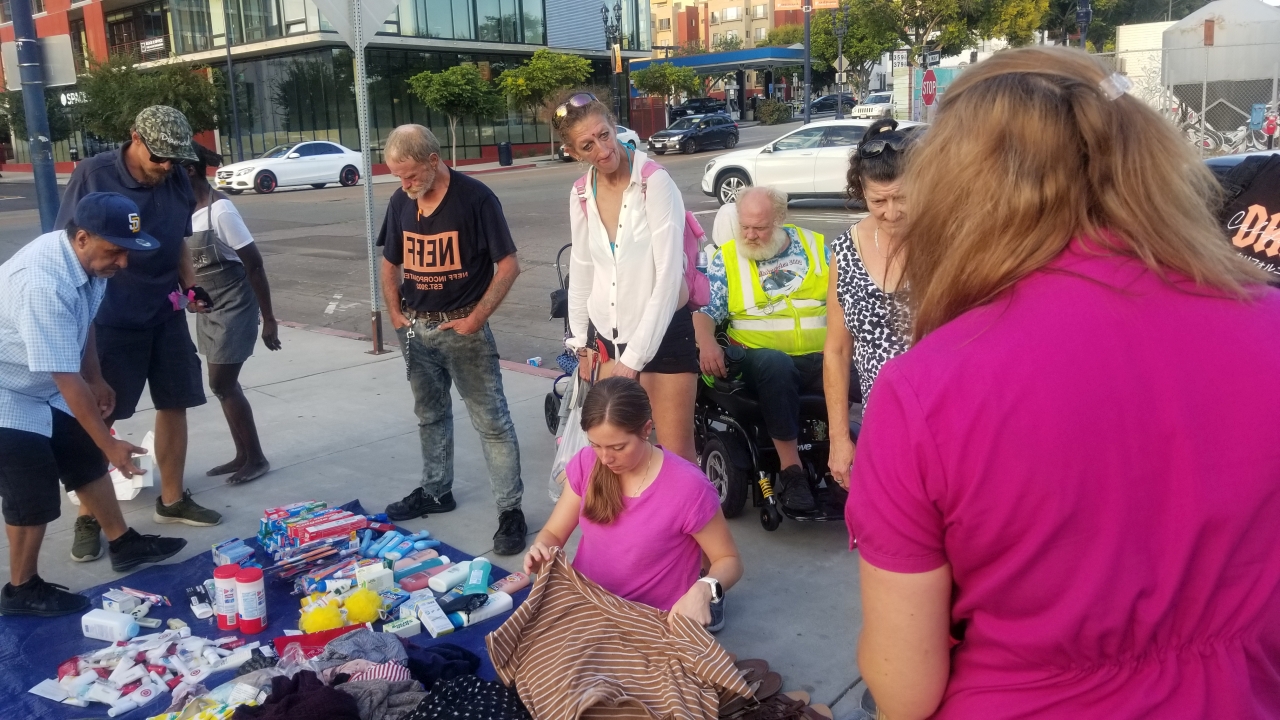 Jenn helps organize the many donations provided by Newport Pacific for San Diego's homeless
