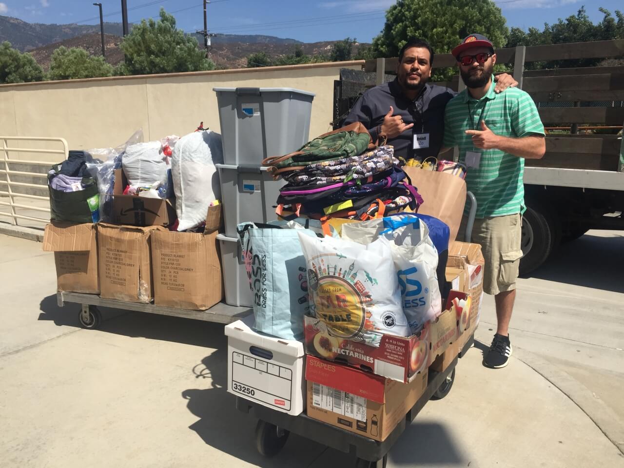 Zo and Nate begin to fill up the truck with some of the donations from Newport Pacific
