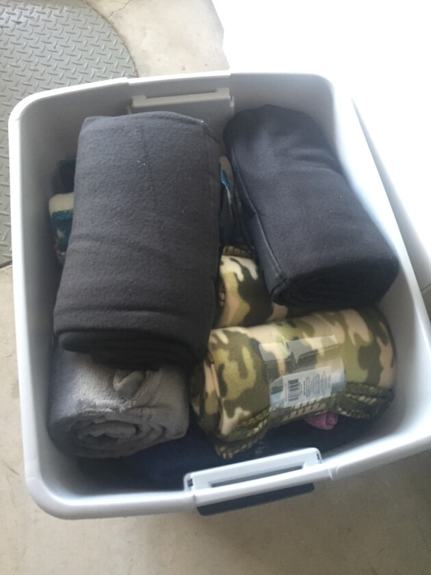 Just one of the many plastic bins full of blanks for the homeless in downtown San Diego donated by Newport Pacific