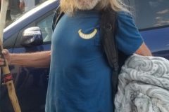A homeless man appreciates his blanket donated by Newport Pacific.