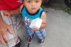 Little Antonio loved holding a bar of soap donated by Newport Pacific.