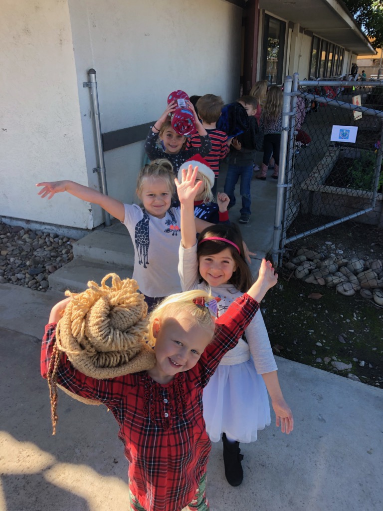 The kids are excited to bring out the blankets for the homeless.