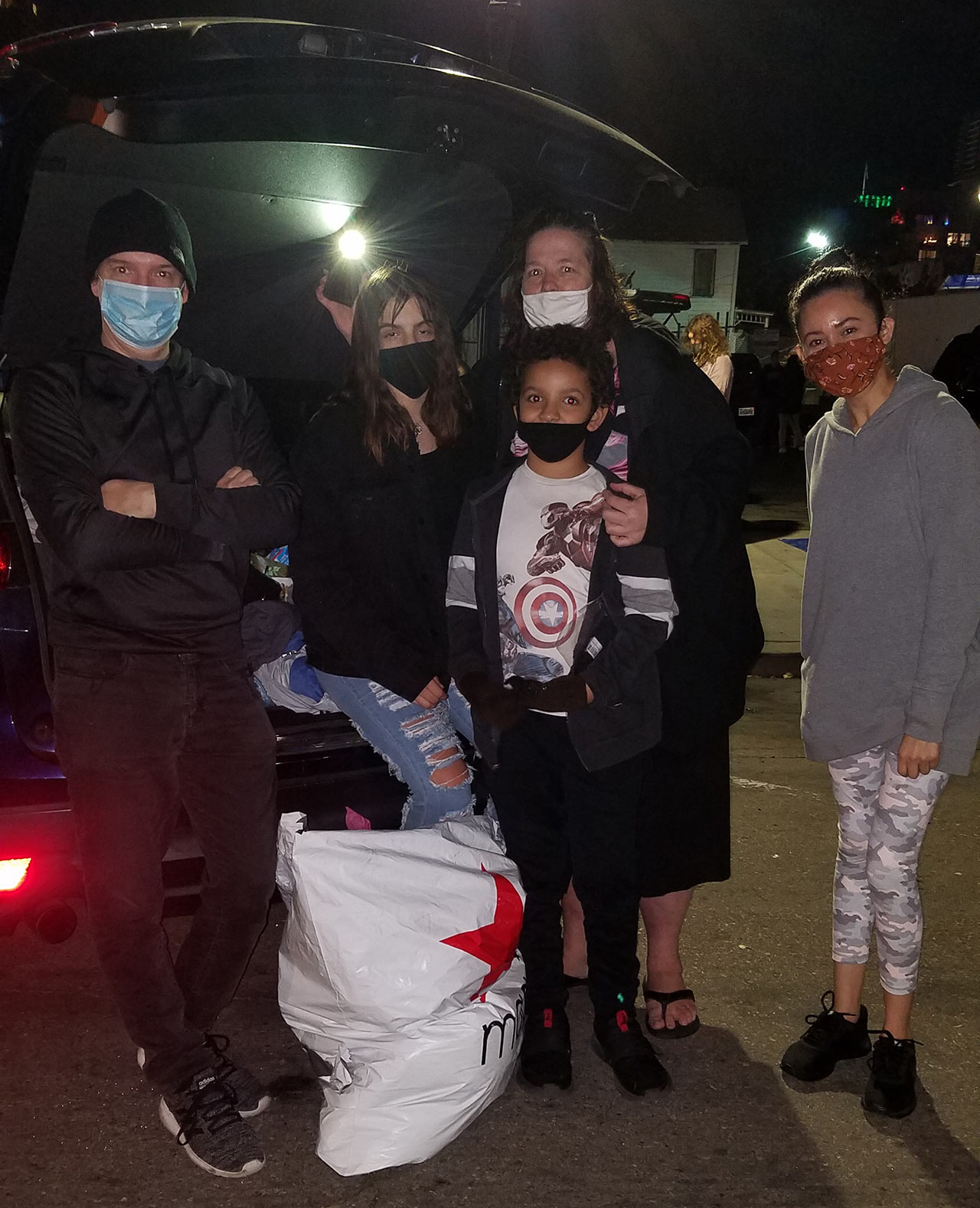 Monday night before Christmas passing out items donated by Sharp Mesa Vista staff