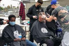 Country Club Barber shop cutting the homeless hair on the streets in downtown San Diego