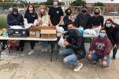 SDSU's Helping the Homeless passing food and care packages to the homeless downtown