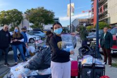Nicole presents the 37 kits consisting of water bottles, snacks, washcloths, toothbrushes, toothpaste, socks,