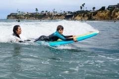 Streets of Hope Kids riding the waves