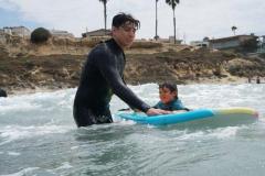 Streets of Hope Kids catching the waves