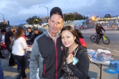 Tammy helps a homeless man at the Streets of Hope San Diego Easter event.