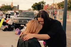 Tammy prays for a homeless woman after cutting her hair on Memorial Day.