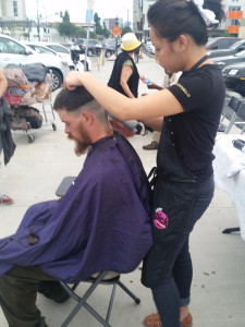 Laura cutting San Diego homeless man's hair