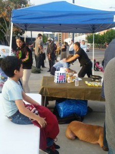 Zayden watching David give a homeless massage.