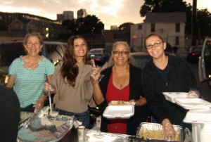 Karen, Marta, Christina and Tammy serving food to the homeless on the streets of San Diego.