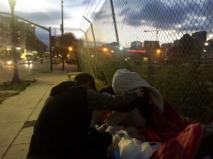 Nate prays for a homeless man in downtown San Diego.