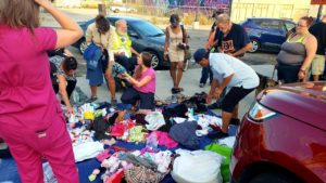 Some downtown San Diego's homeless receiving clothing, blanks and toiletries donated by Newport Pacific