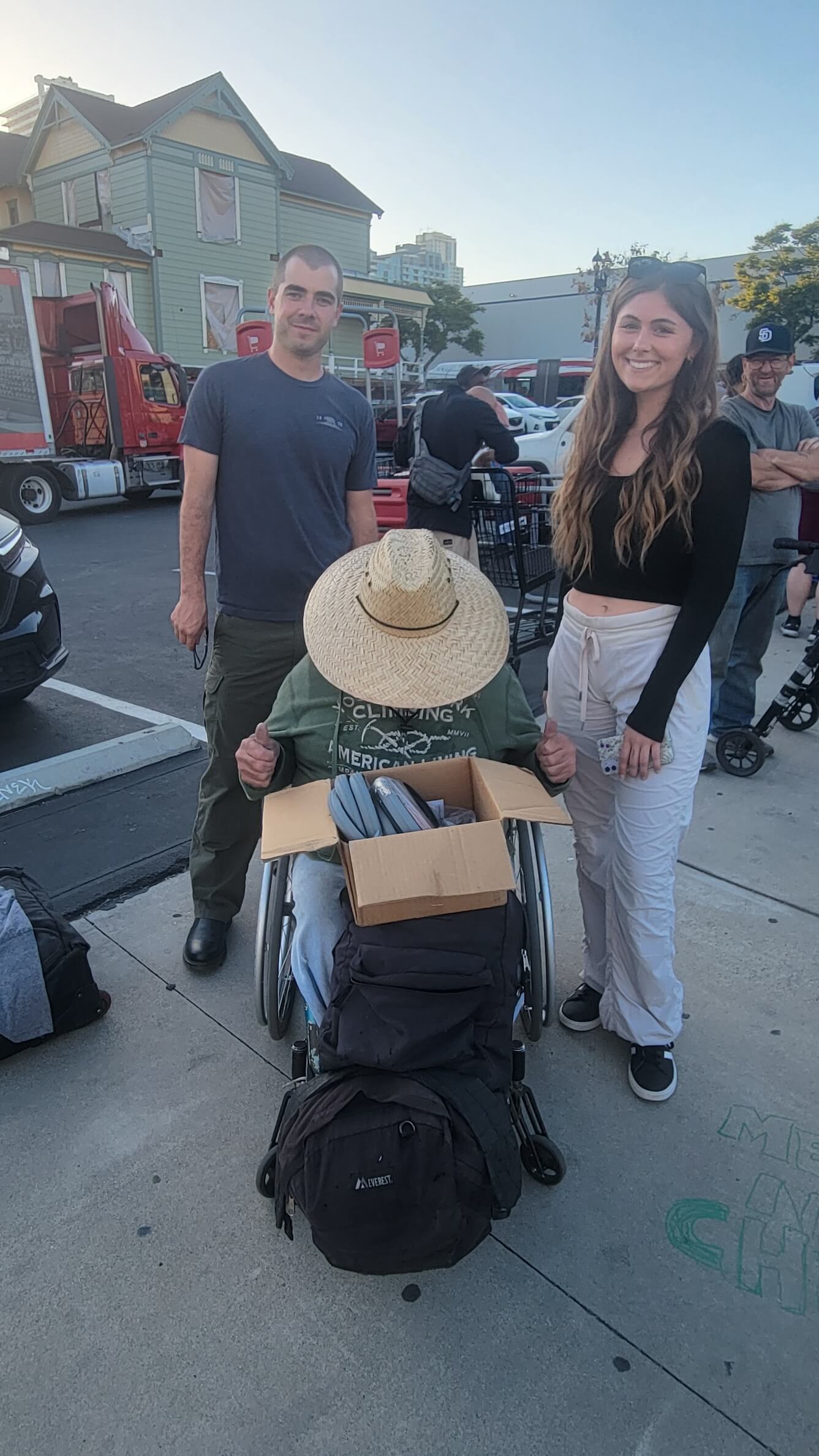 Helping a Homeless Man with his Wheelchair